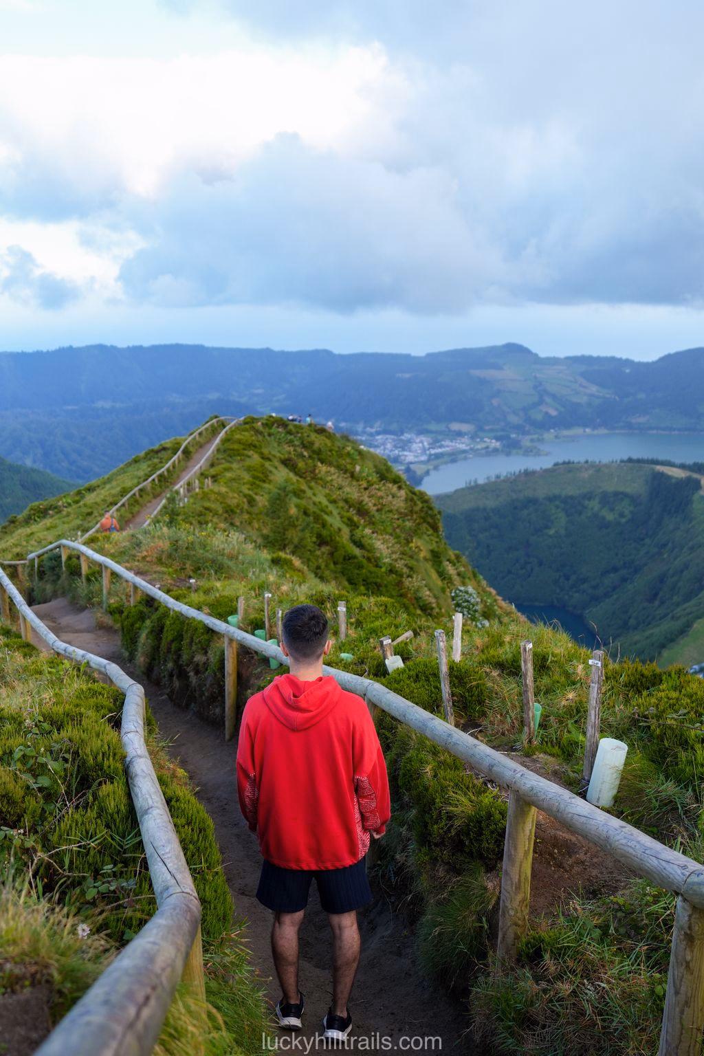 Narrow Grota do Inferno viewpoint with a wooden fence in the fog, São Miguel, Azores
