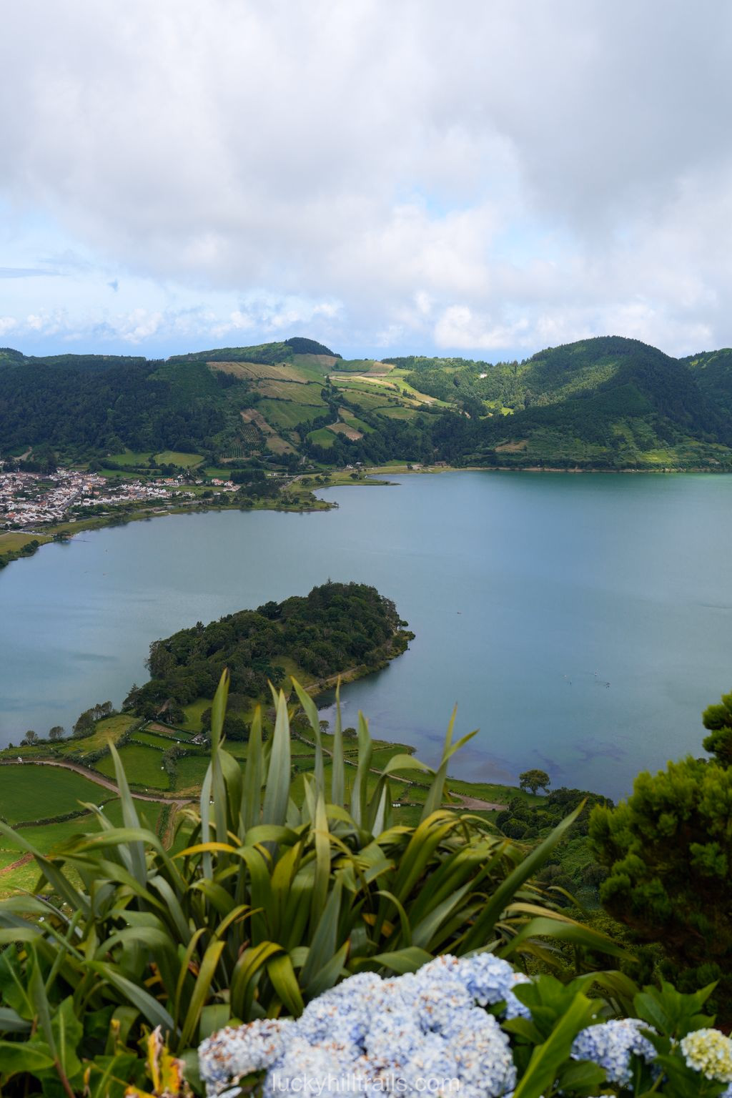 View of the Sete Cidades lakes from Cerrado das Freiras viewpoint and the hydrangea-lined road, São Miguel