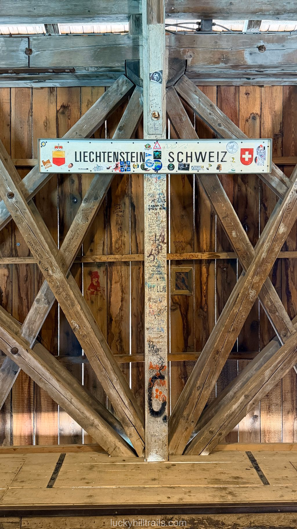 Sign marking the Liechtenstein–Switzerland border inside the Alte Rheinbrücke bridge