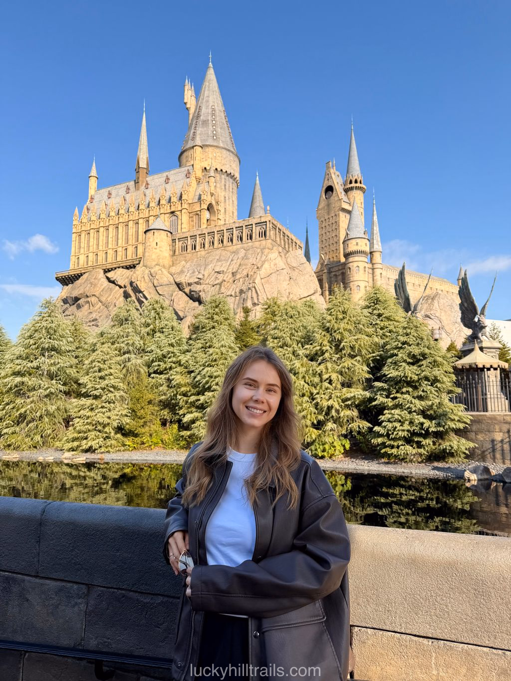 Girl in front of Hogwarts Castle in the Wizarding World of Harry Potter at Universal Studios Japan, Osaka