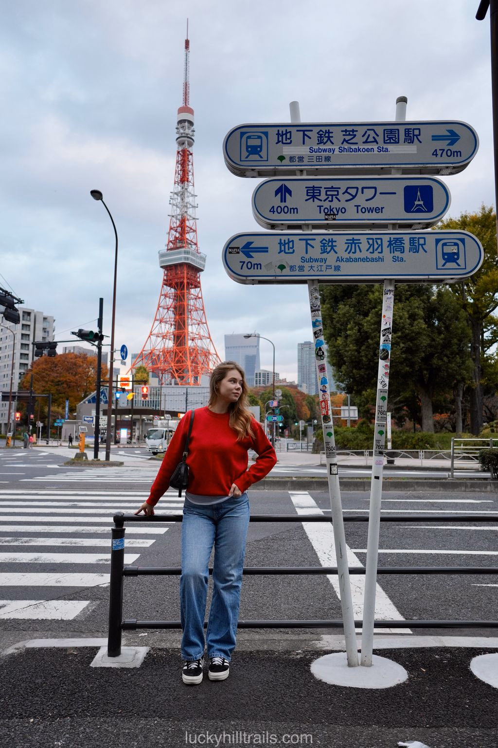 Tall red-and-white Tokyo Tower against the city backdrop